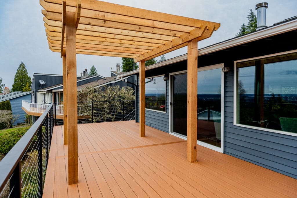 Custom patio cover built over a composite deck by 3 Brothers Decking in the Pacific Northwest
