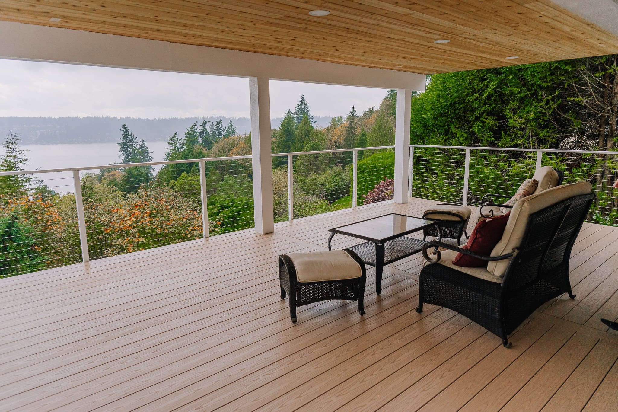 Covered deck with comfortable outdoor furniture, perfect for all-weather entertaining