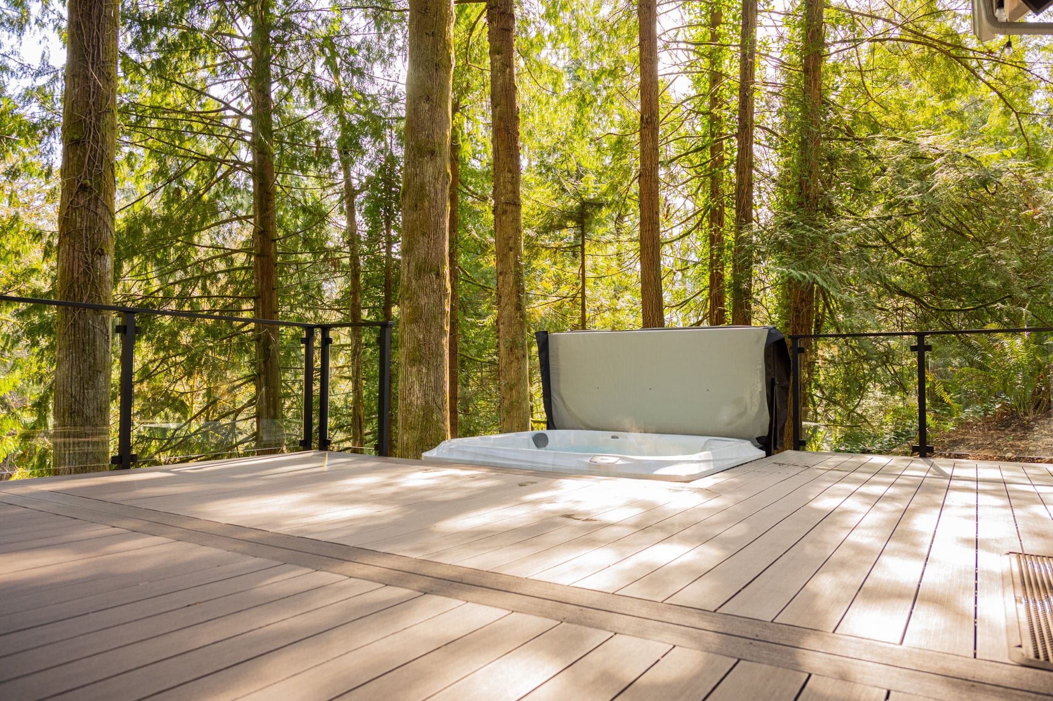 Forest deck with built-in outdoor hot tub
