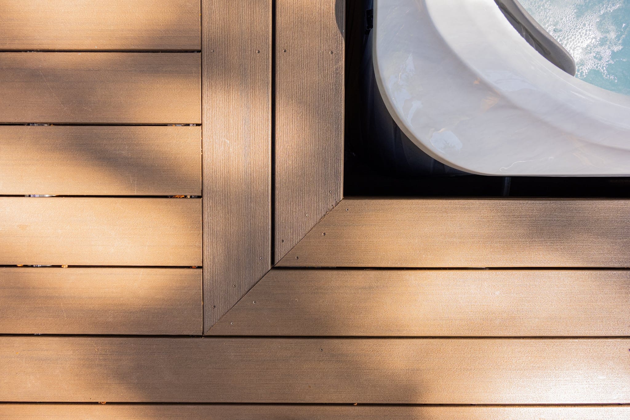 Wooden deck corner beside outdoor hot tub