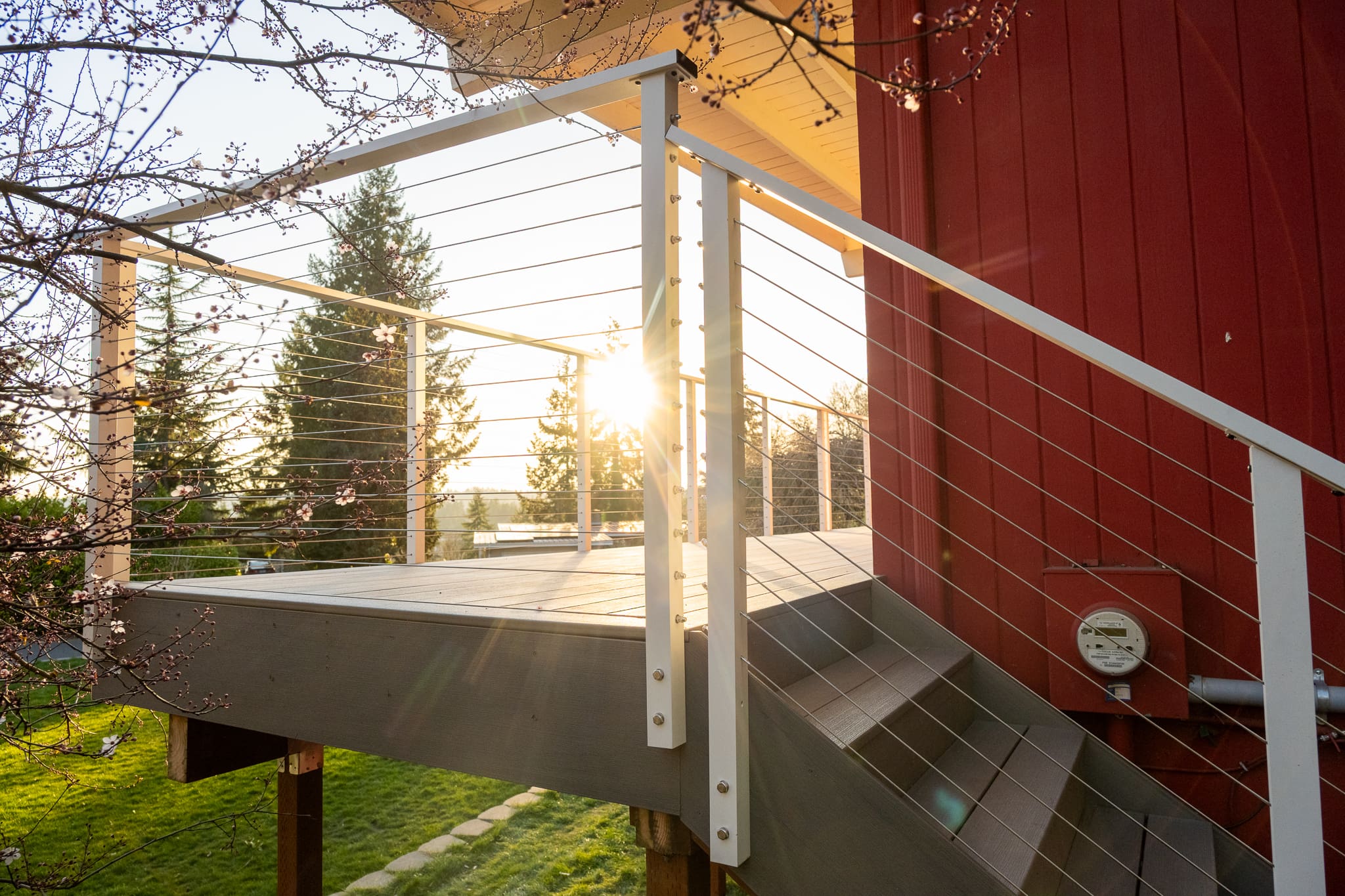 Modern deck with cable railing at sunset