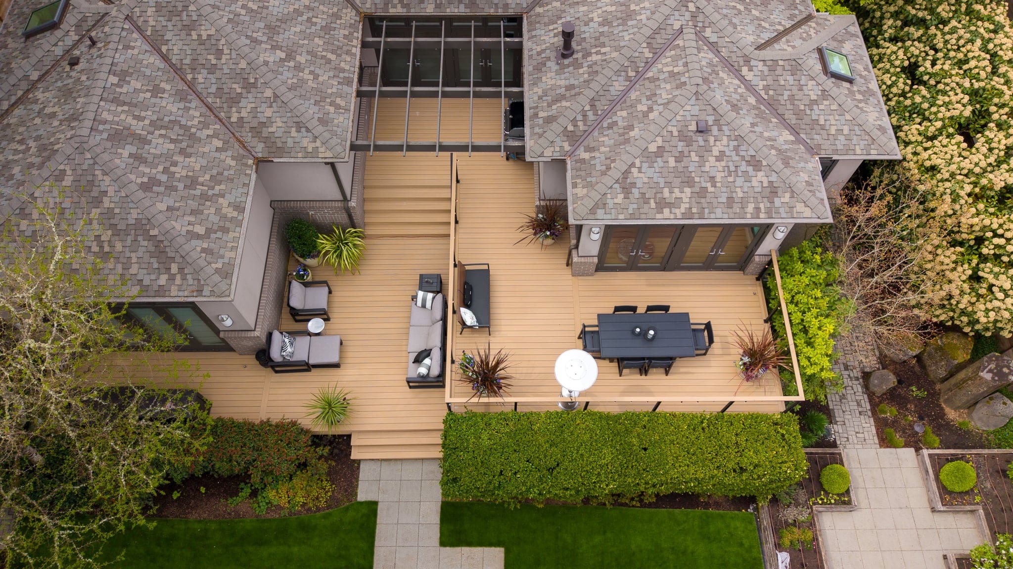 Aerial view of modern home with spacious deck