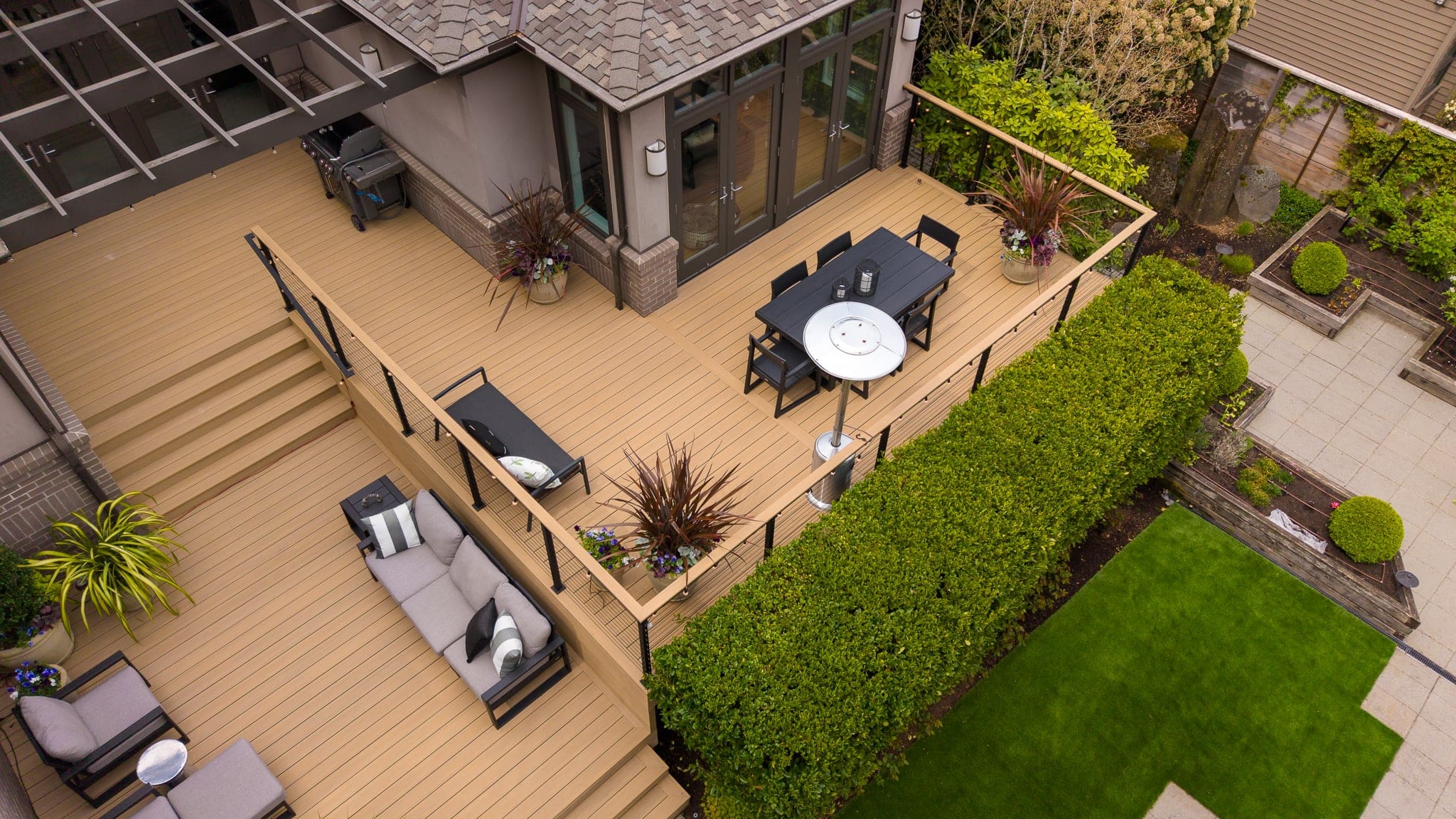 Modern backyard deck with outdoor dining and seating